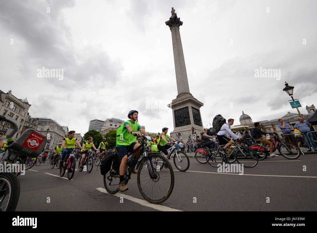 Ride London Cyclists pass Trafalgar Square on the closed roads of the