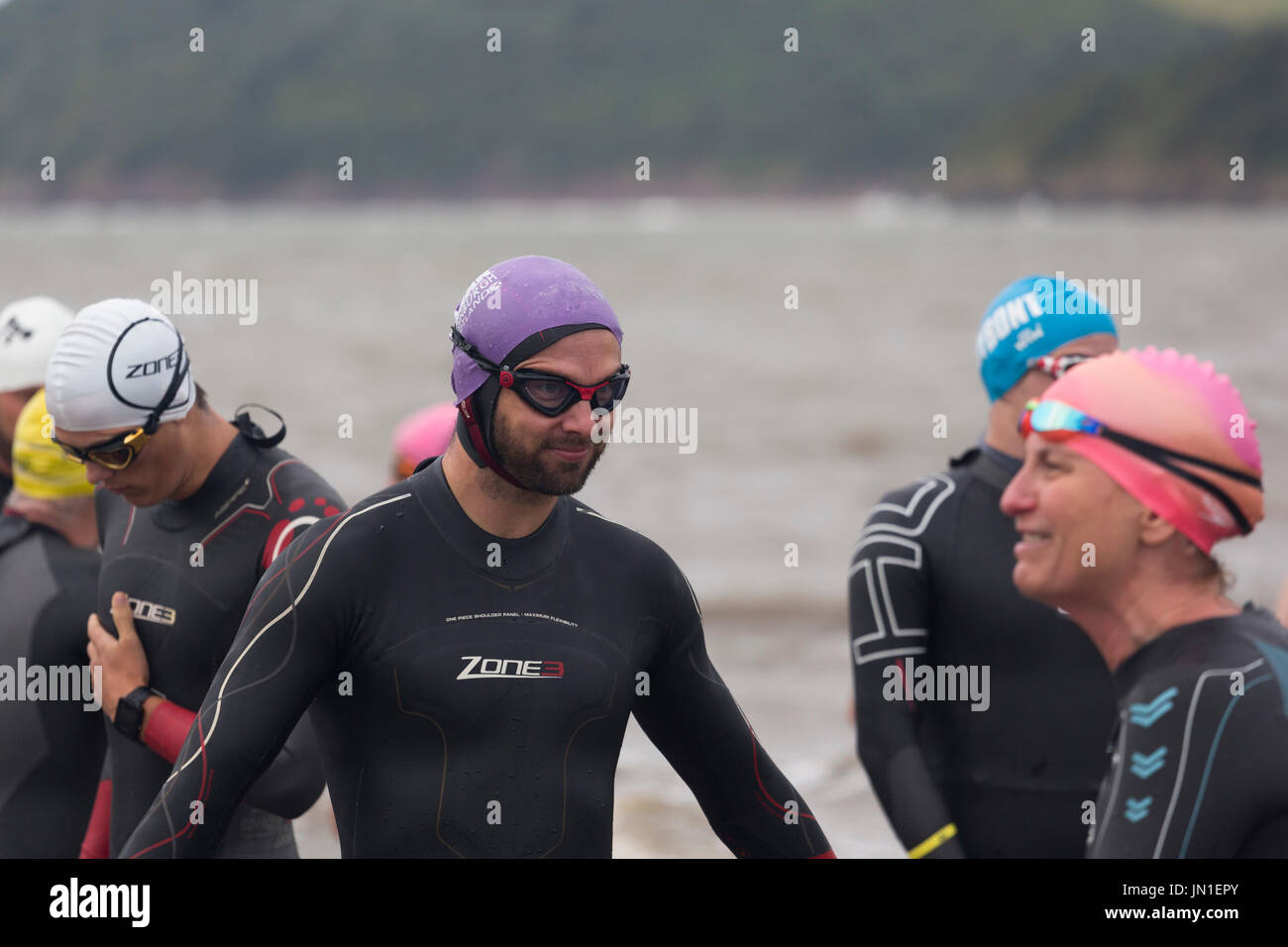 Ferryside, Carmarthenshire, Wales, UK. Saturday 29th July 2017. Swimmers take part in the 2km Welsh Open Water Estuary Swim from Ferryside in the Tywi Estuary. It is one of only a few wild swimming events to take place in an estuary and raises money for local charities. Credit: Gruffydd Thomas/Alamy Live News Stock Photo