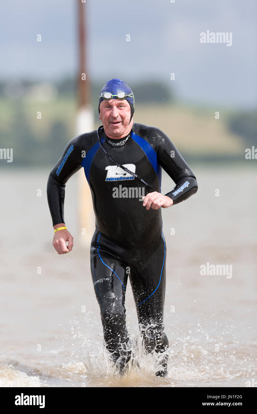 Competitors in wetsuits of the 2017 Welsh Open Water Estuary wild water