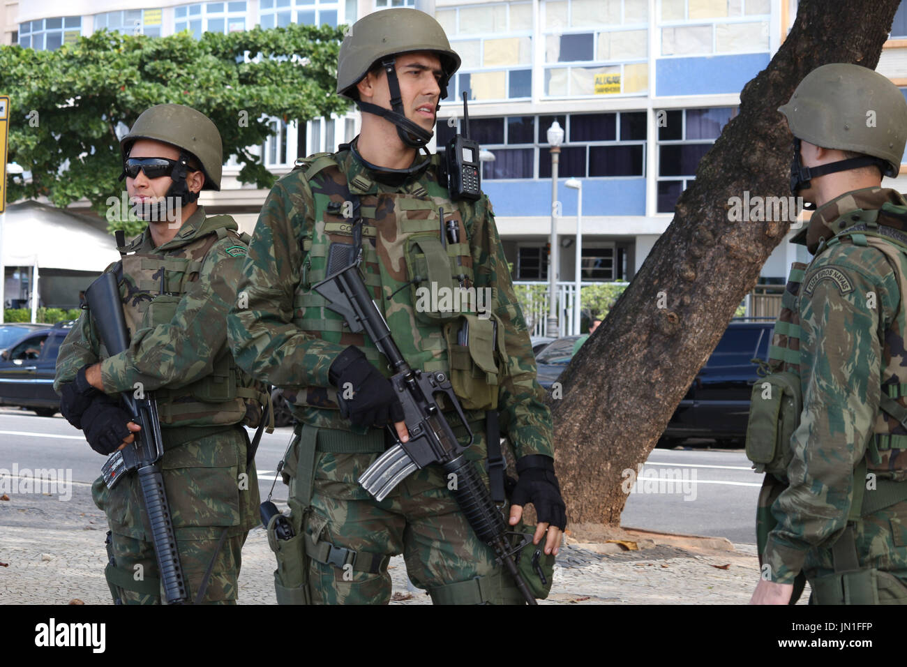 Rio de Janeiro, Brazil, July 29, 2017. Approximately 10,000 military personnel from the Navy, Army and Air Force were called in to strengthen security in Rio de Janeiro after the state completely lost control of public safety and reached alarming levels of crime. The military will do policing on expressways, favelas and tourist spots in the city. In this image: Marines patrol the edge of Copacabana Beach. Stock Photo