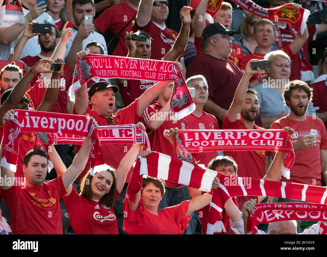 Berlin, Germany. 29th July, 2017. Liverpool fans sing and wave scarves in  the stands ahead of the international club friendly soccer match between  Hertha BSC and FC Liverpool in the Olympia Stadium