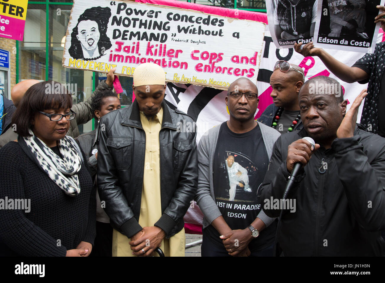 London, UK. 29th July, 2017. (C), the father of Rashan Charles, attends a vigil and protest over the death of his son outside Stoke Newington police station in east London with other members of the community and the Labour Party's Shadow Home Secretary Diane Abbott, member of parliament for Hackney North and Stoke Newington. Credit: Thabo Jaiyesimi/Alamy Live News Stock Photo