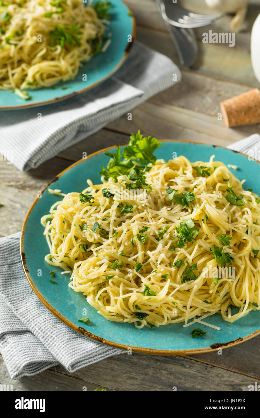 Garlic and Parsley Agnel Hair Pasta with Cheese Stock Photo