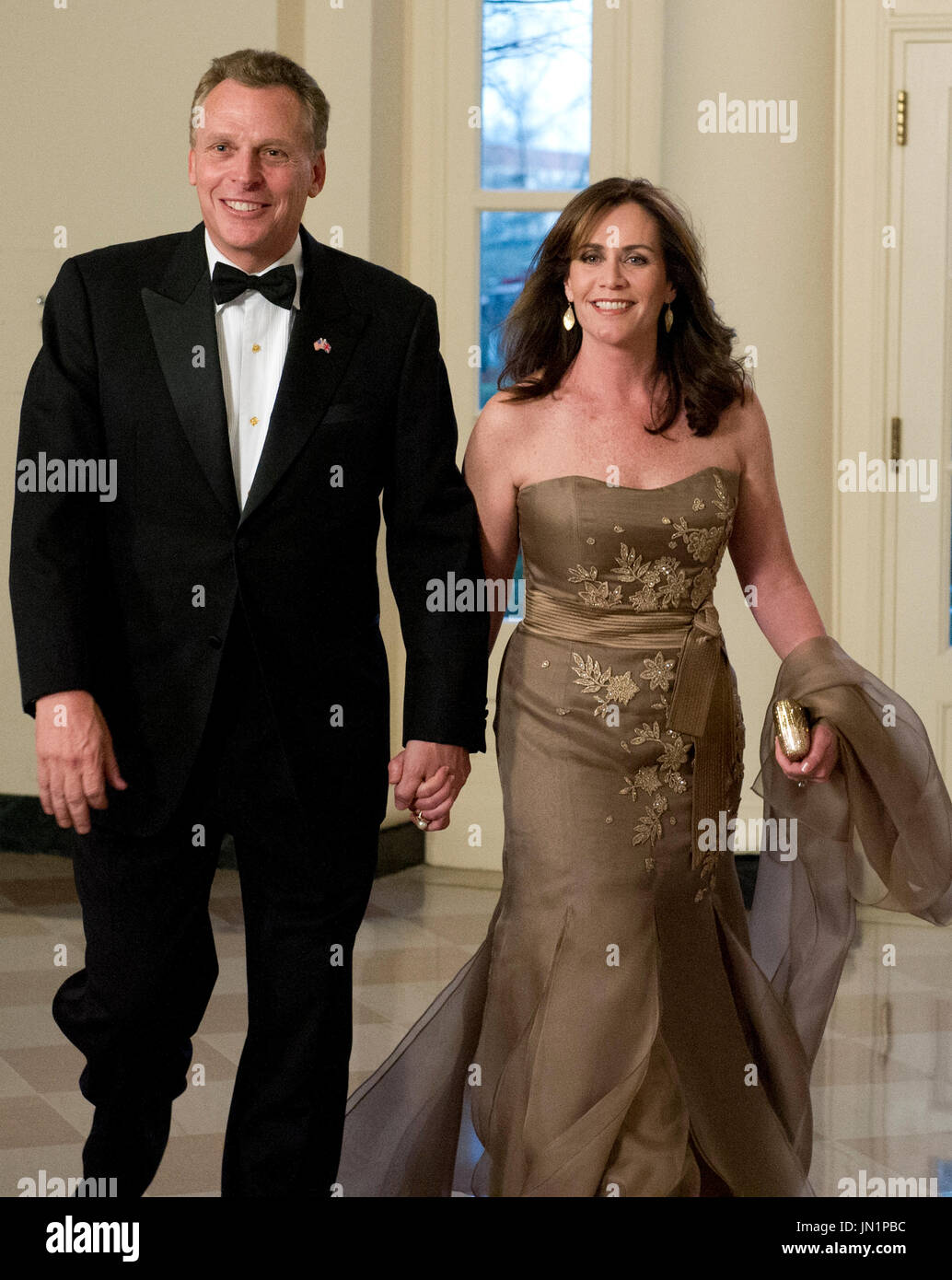 Terry McAuliffe and his wife, Dorothy, arrive for the Official Dinner