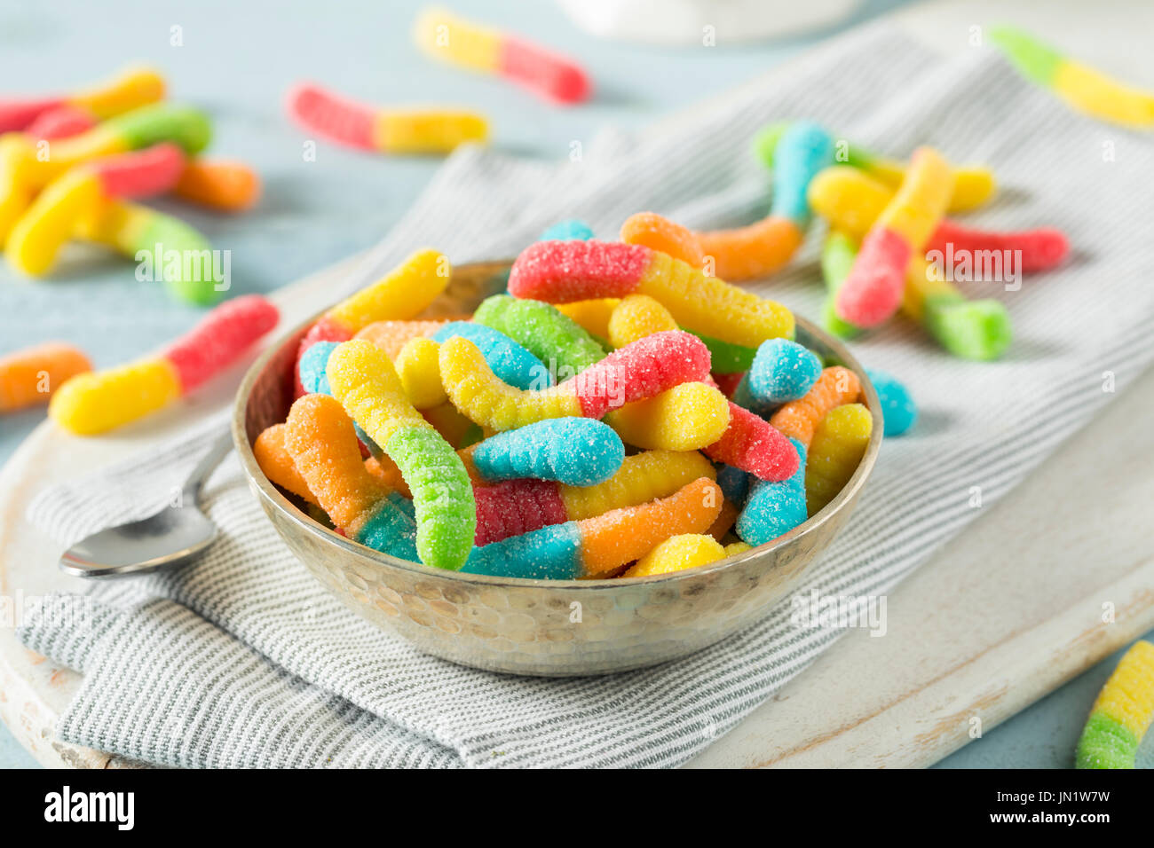 Sweet Sour Neon Gummy Worms with a Sugar Coating Stock Photo
