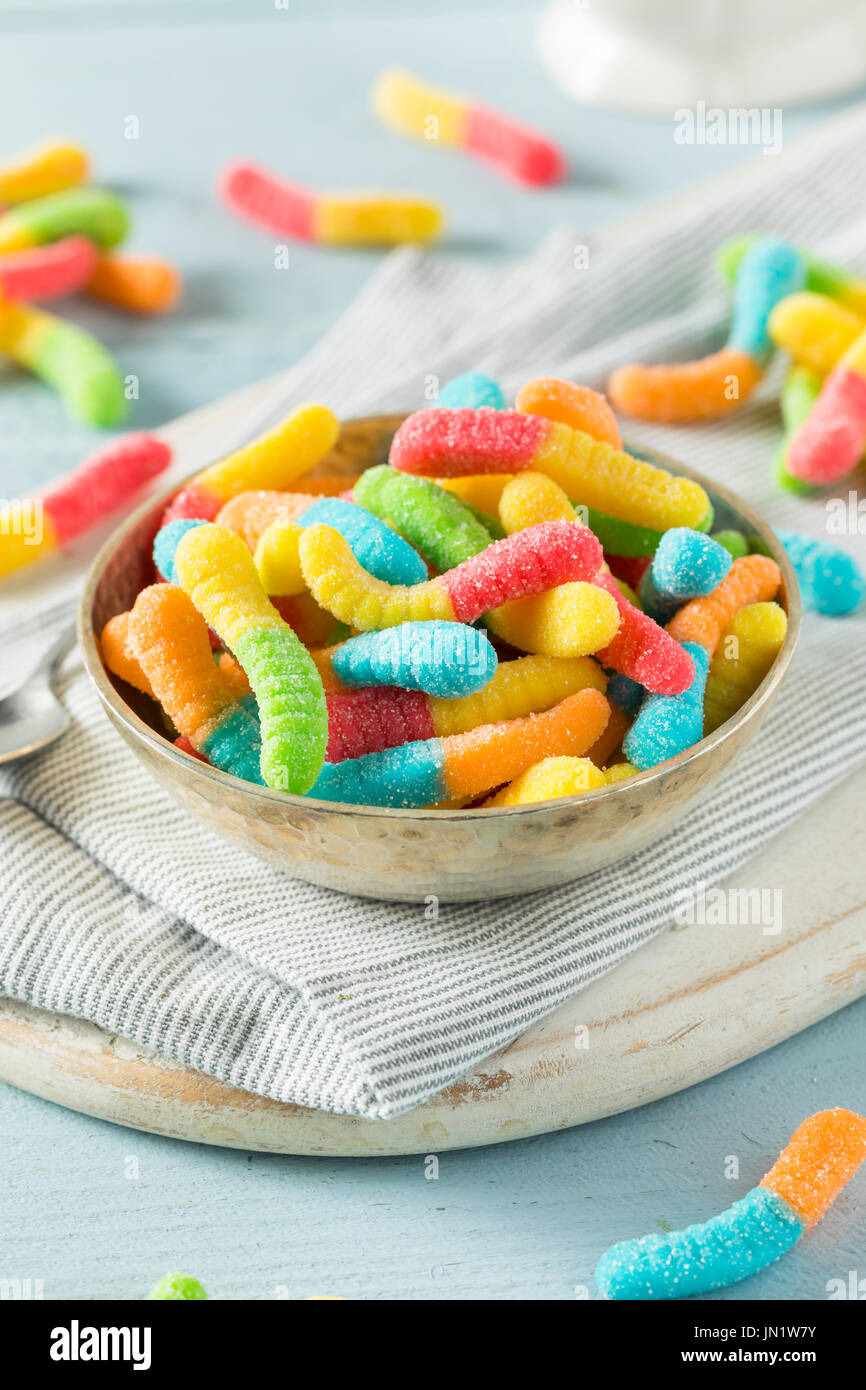 Sweet Sour Neon Gummy Worms with a Sugar Coating Stock Photo