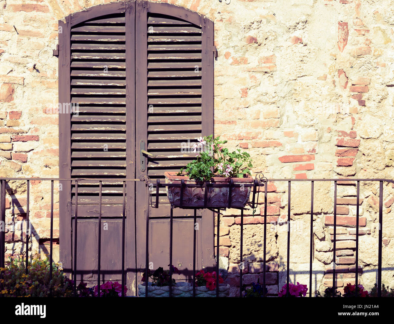 Typical italian door in the historic district of Colle Val d'Elsa a small town near Siena in Tuscany Stock Photo