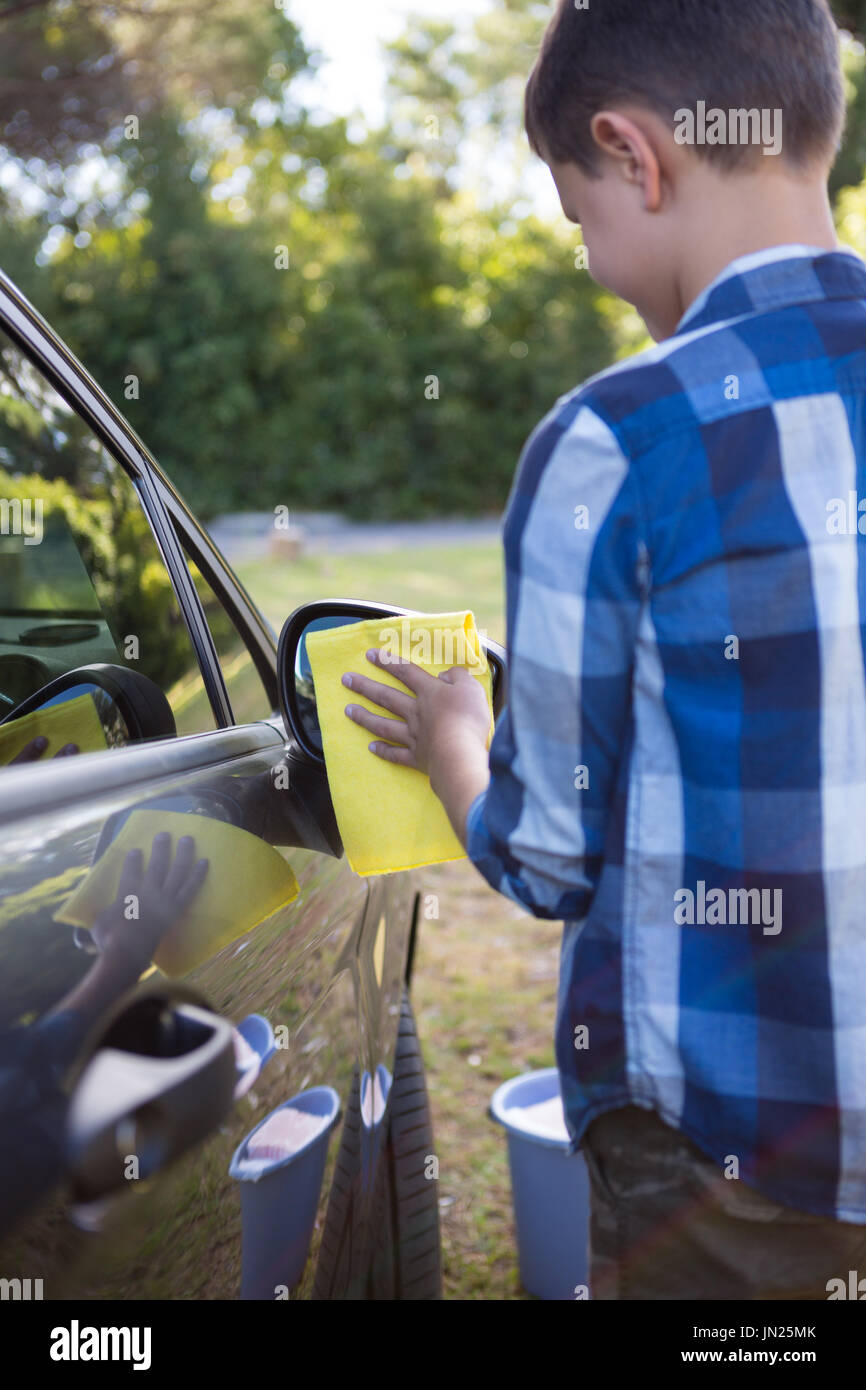 Teenage boy washing car hires stock photography and images Alamy