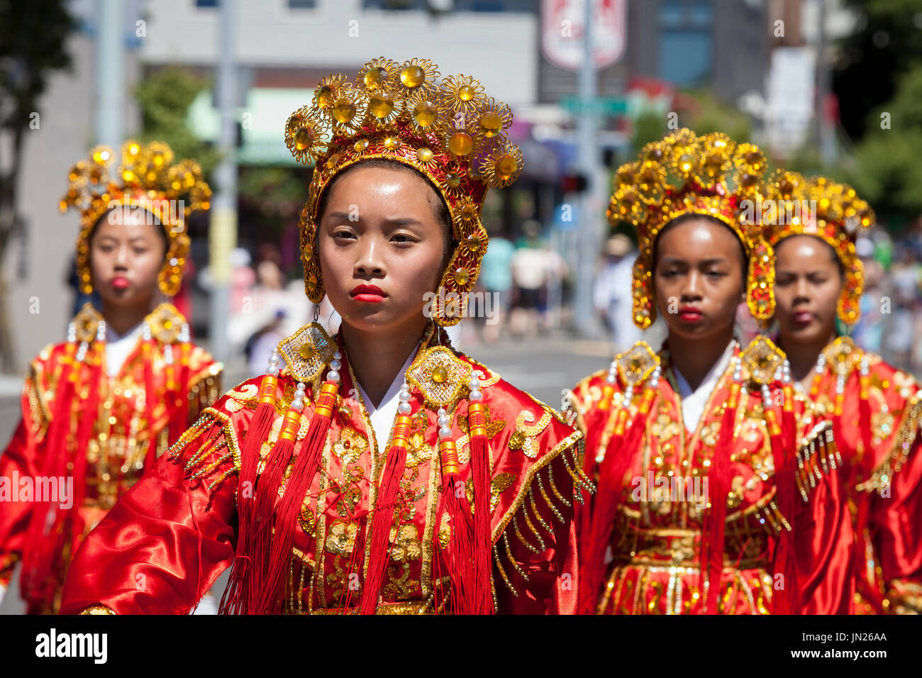 Seattle, Washington: Chinese Community Girls Drill Team performs at the West Seattle Grand Parade. The annual parade, hosted by the West Seattle Rotar Stock Photo