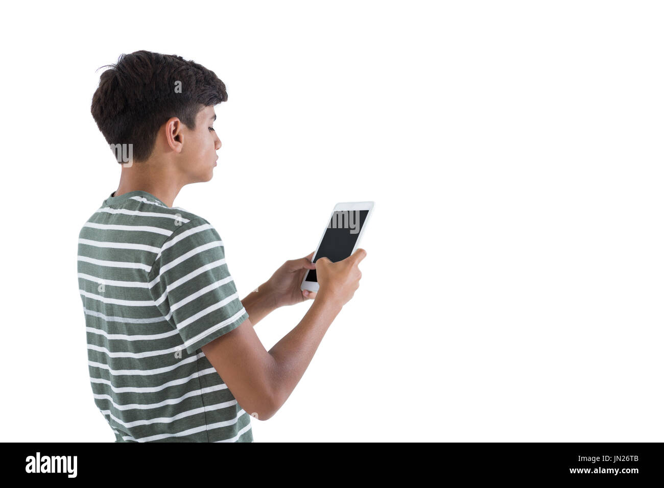 Teenage boy using digital tablet against white background Stock Photo ...