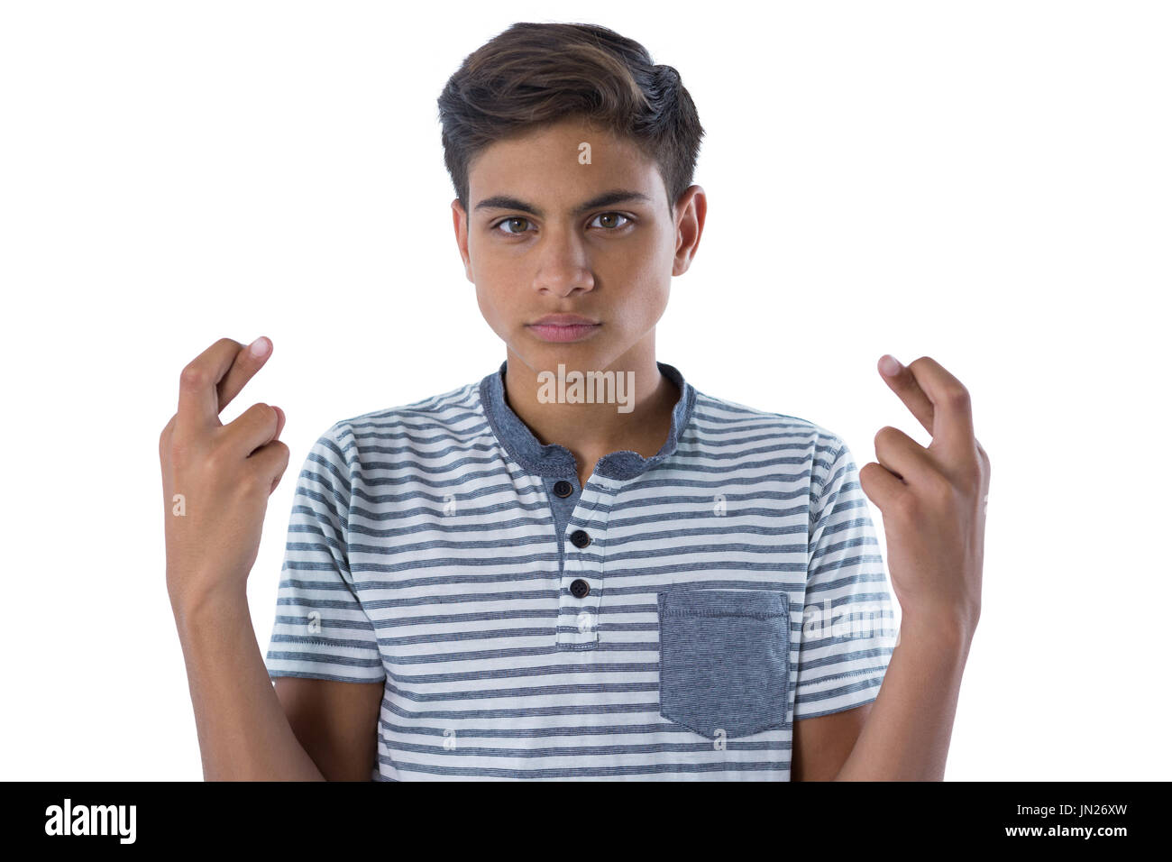 Portrait of teenage boy holding her fingers crossed Stock Photo Alamy