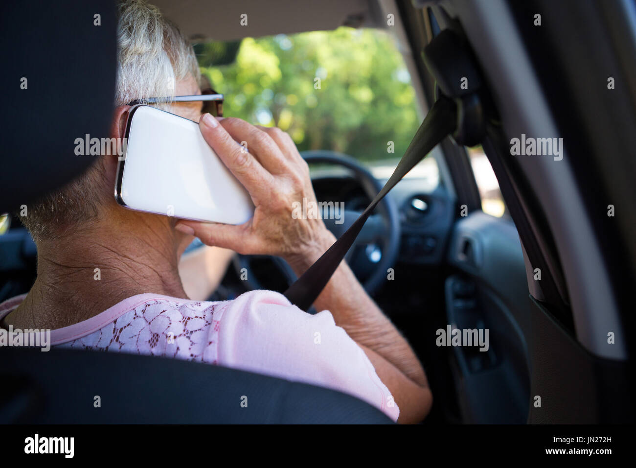 Female rear view mobile sitting hi-res stock photography and images - Alamy