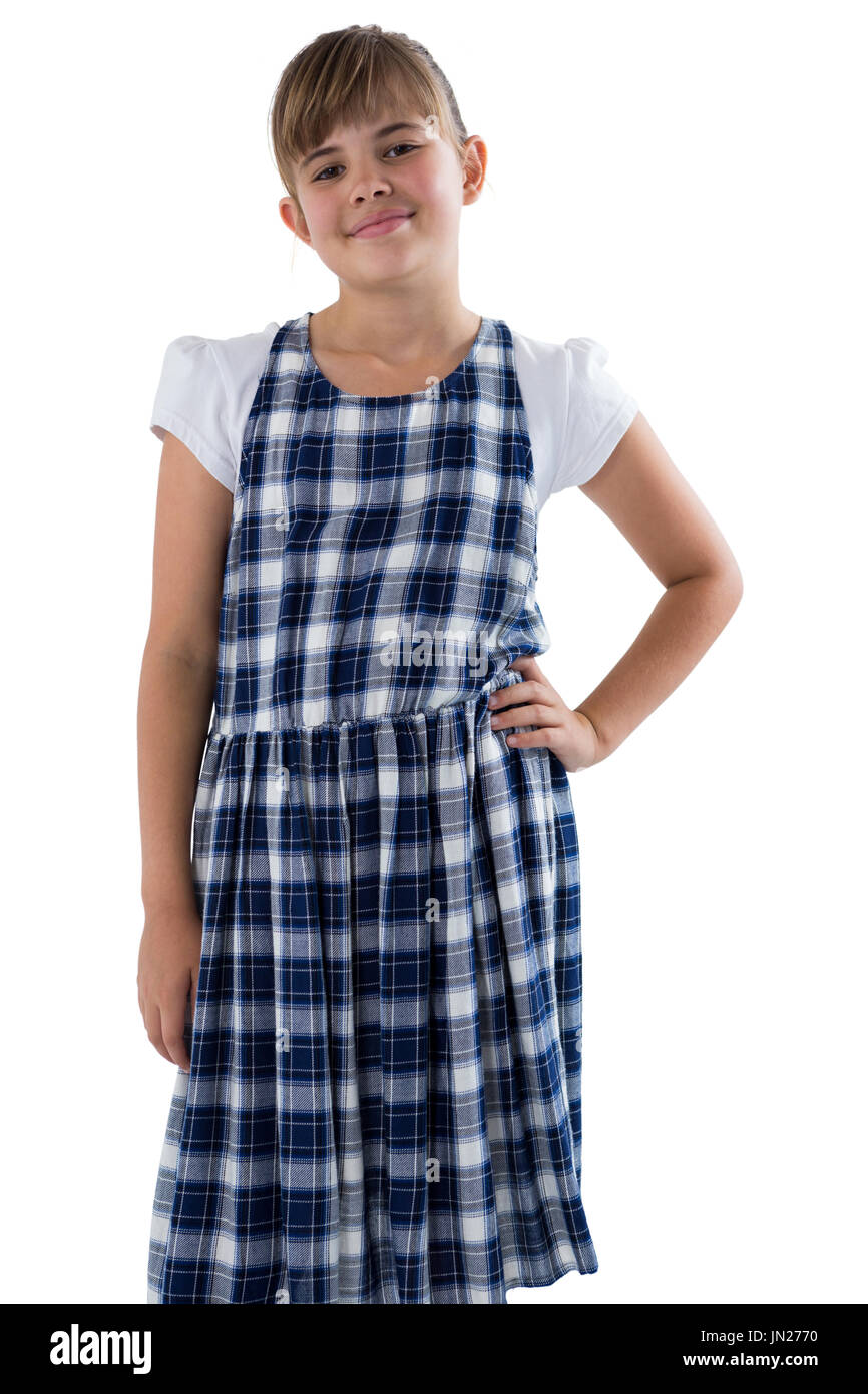Portrait of cute girl standing with hand on hip on white background ...