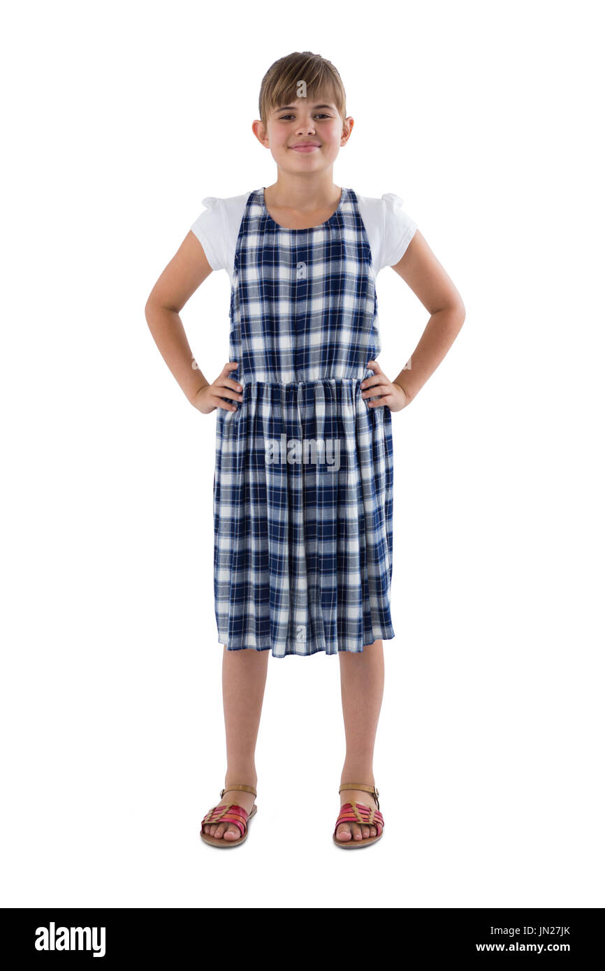 Portrait of cute girl standing with hands on hip on white background