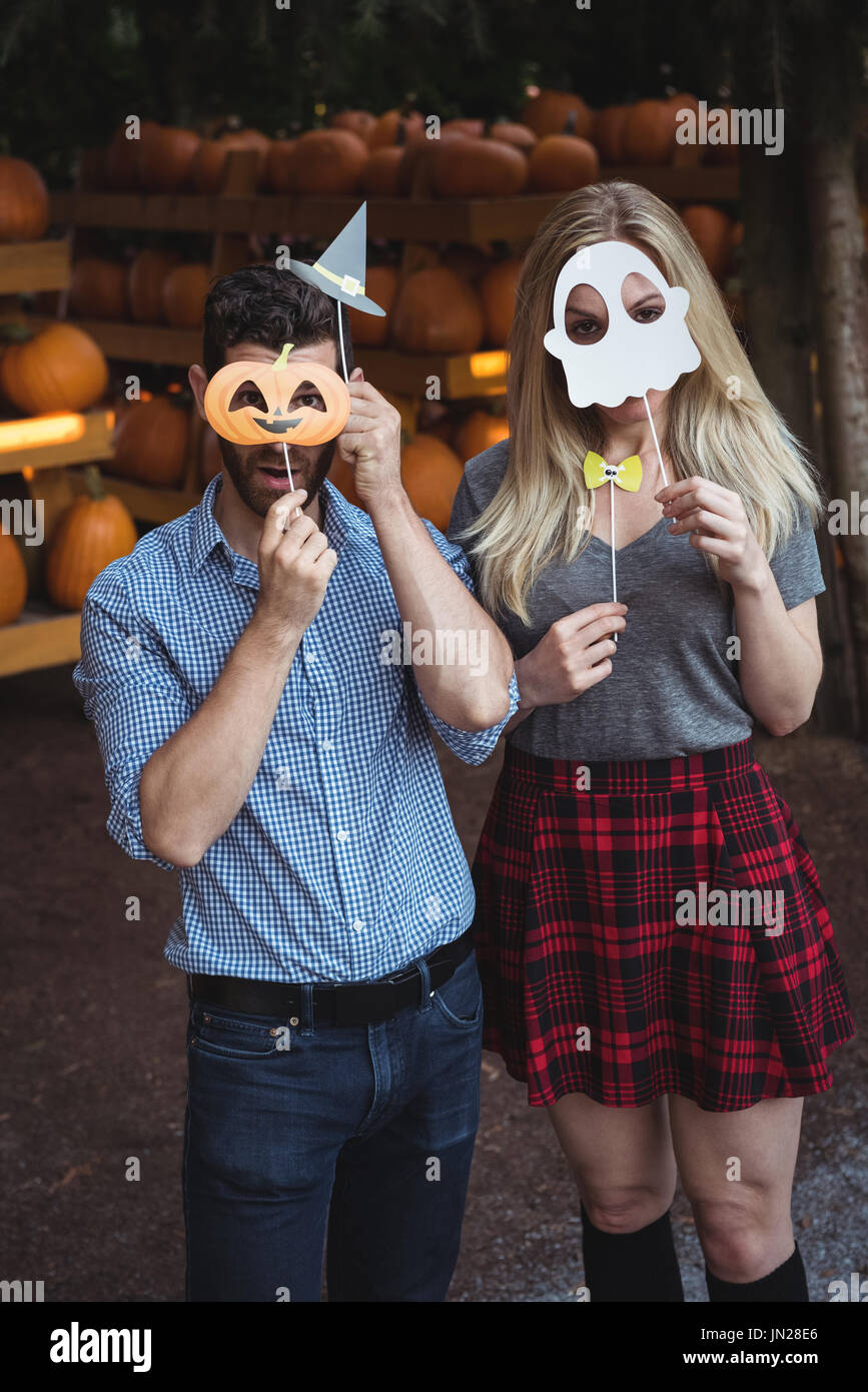 Couple wearing halloween mask Stock Photo