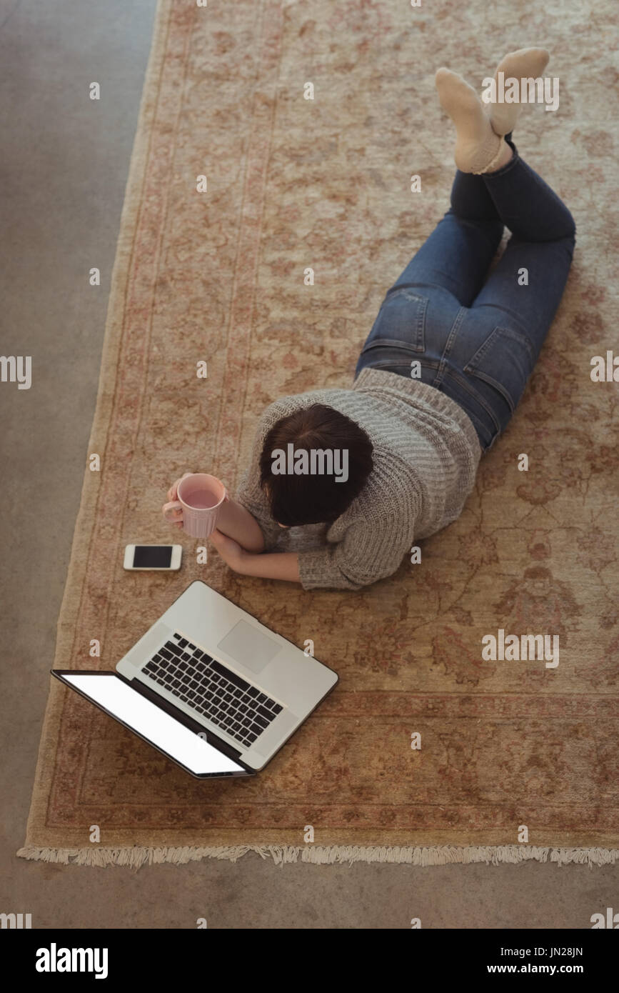 Woman lying on floor hi-res stock photography and images - Alamy