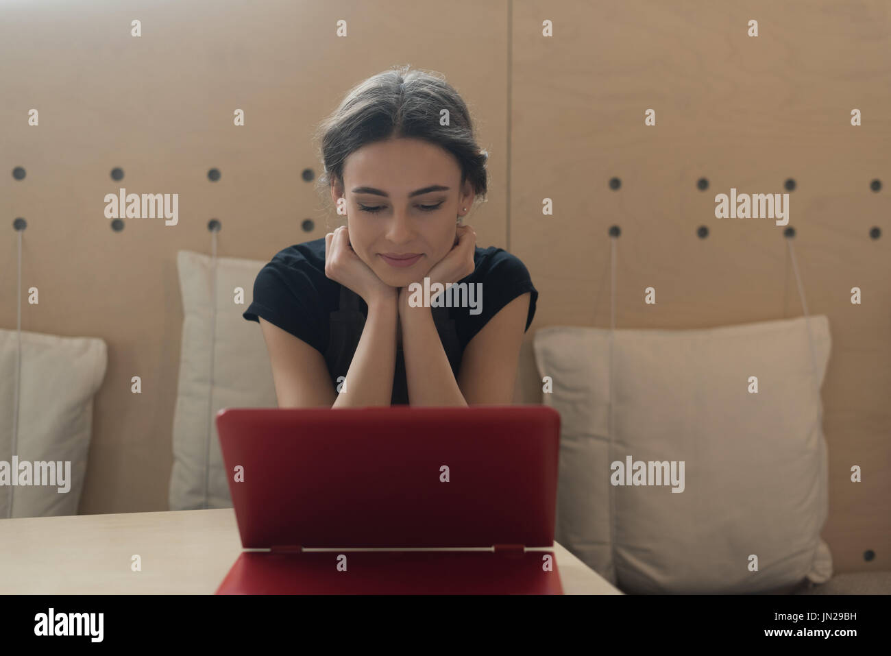 Female owner using laptop while sitting at table in cafe Stock Photo