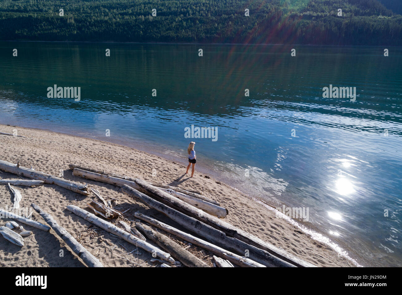 Woman standing lake shore hi-res stock photography and images - Alamy