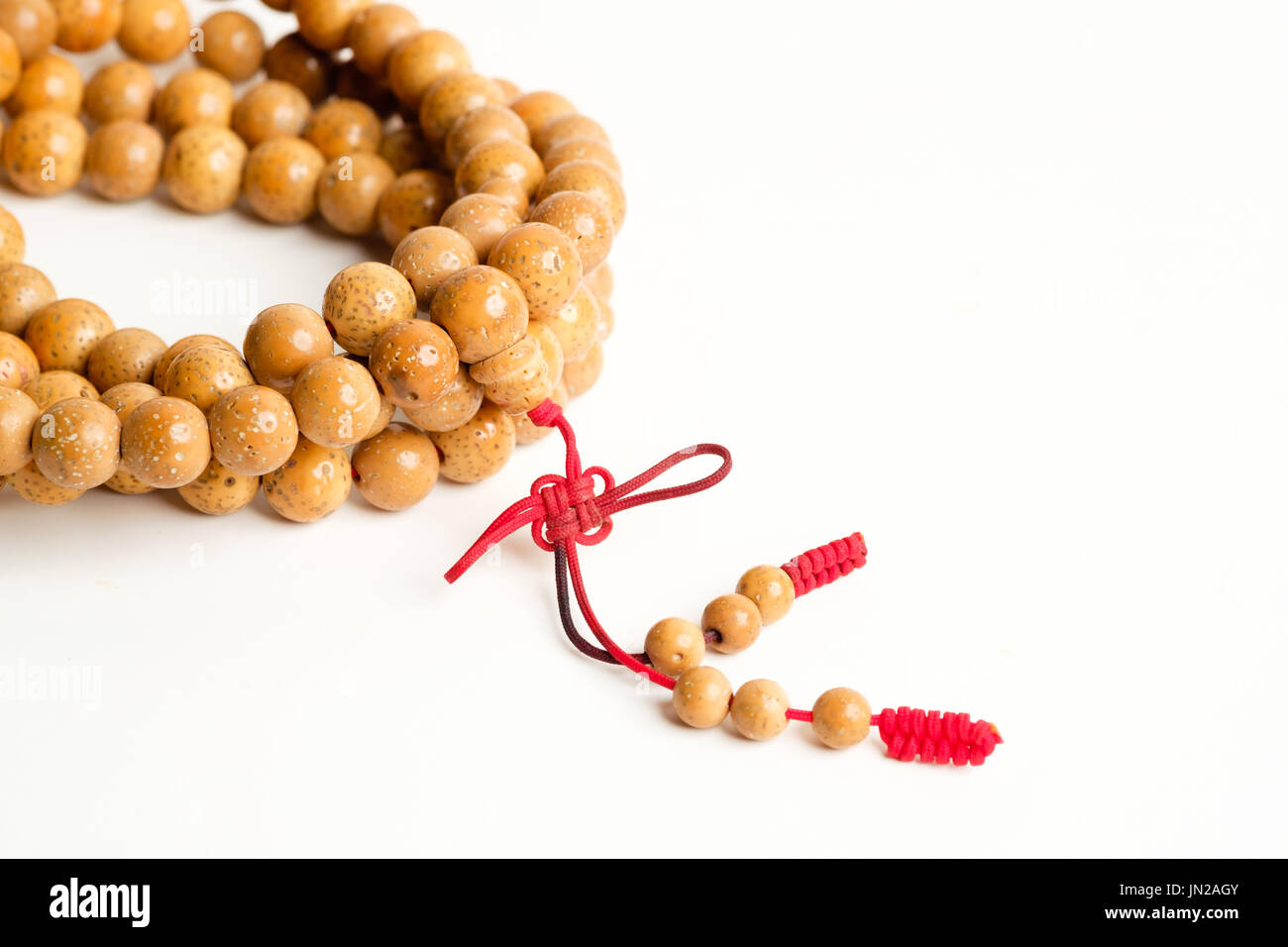 Praying and reciting wooden beads Stock Photo