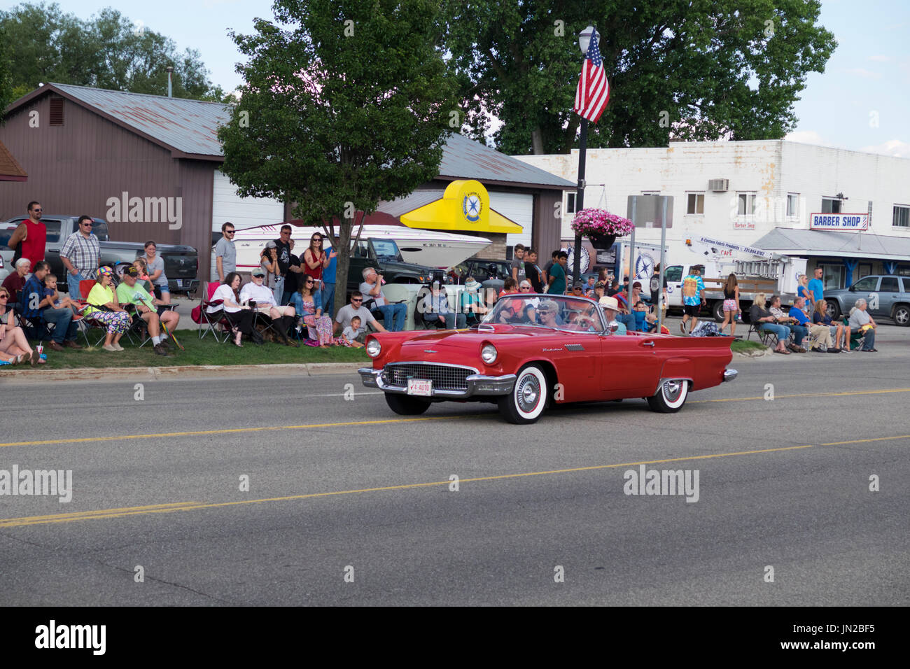 Restored 1957 Ford Thunderbird participates in the annual Cruz-In parade in Montague, Michigan. Stock Photo