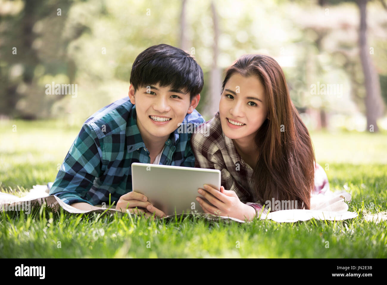 Young couple using digital tablet. Stock Photo