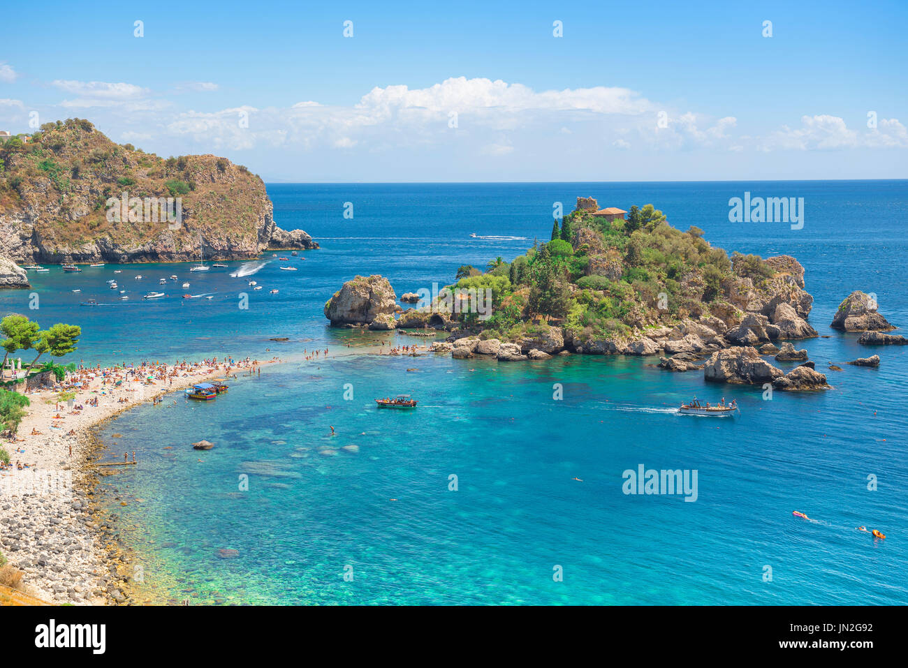 Isola Bella Sicily, view in summer of the beach at Mazzaro near Taormina, Sicily, showing the small island known as Isola Bella - beautiful island. Stock Photo