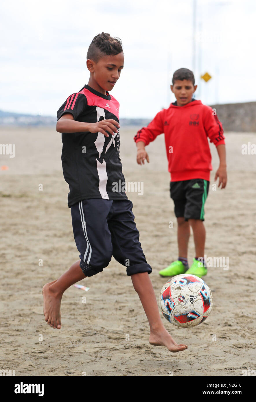 Two players from Al-Helal Football Academy in Gaza, who trained with former Republic of Ireland Football Manger Brian Kerr on Sandymount Strand in Dublin as part of a nine-day trip around the country. Stock Photo