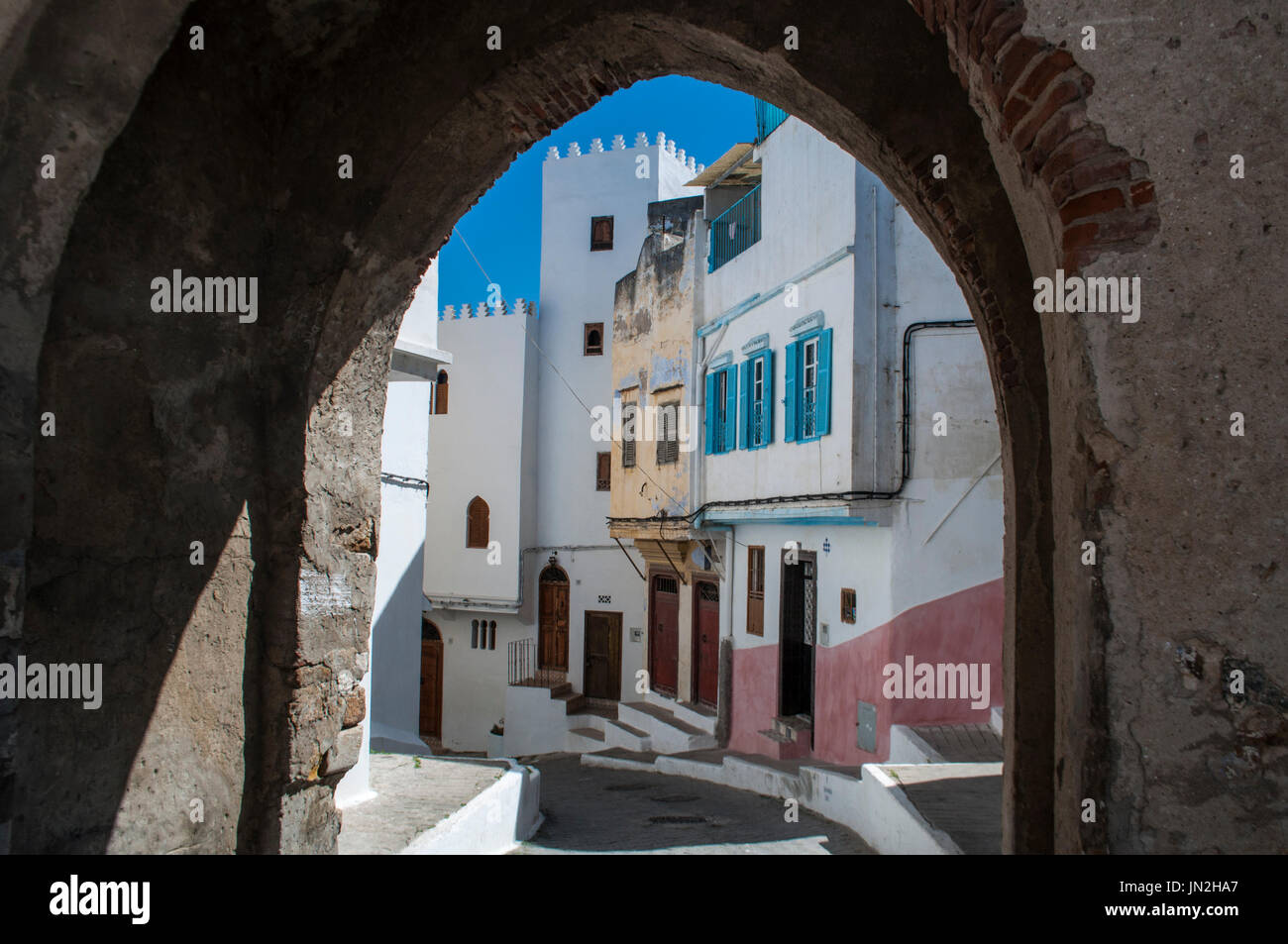 An arch and the narrow alleys of Tangier, city on the Maghreb coast 