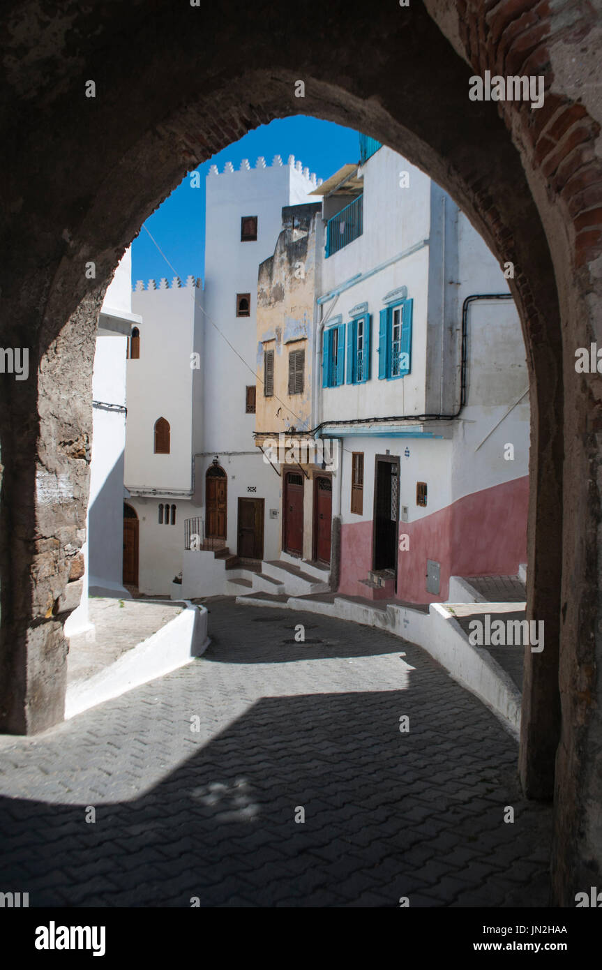 An arch and the narrow alleys of Tangier, city on the Maghreb coast 