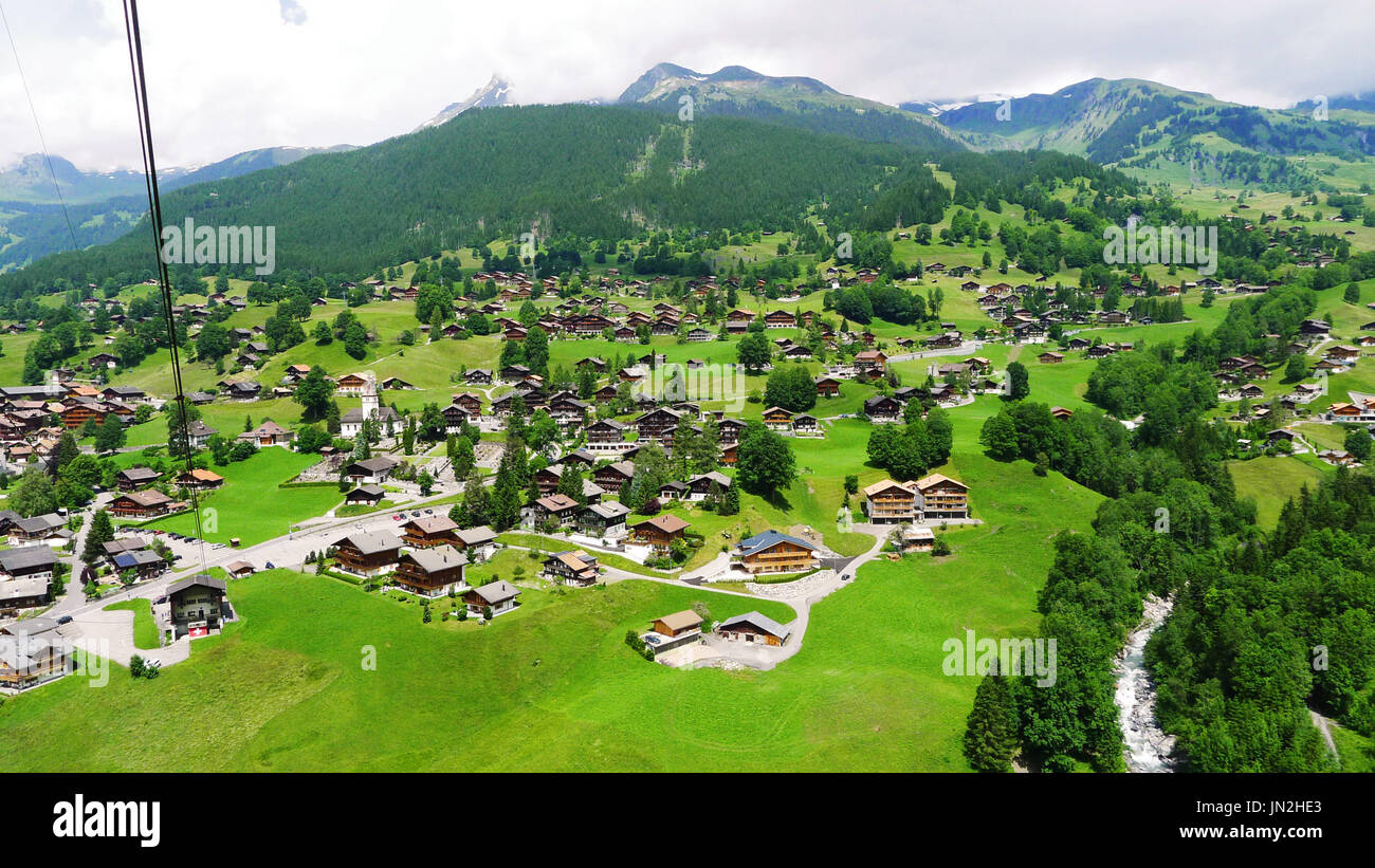 Village view from a cable car ride in the Swiss Alps, Switzerland Stock Photo