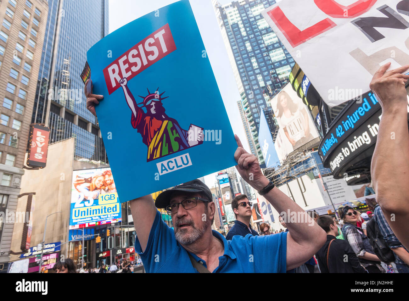 New York, NY 26 July 2017 In response to President Trump's tweet to ban transgender people from the military advocates, activists, and allies converged on the Military Recruitment Center in Times Square in protest. ©Stacy Walsh Rosenstock/Alamy Live News Stock Photo