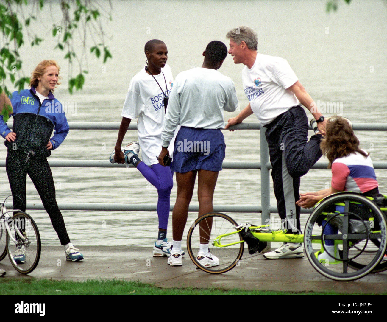 United States President Bill Clinton does some stretching exercises ...