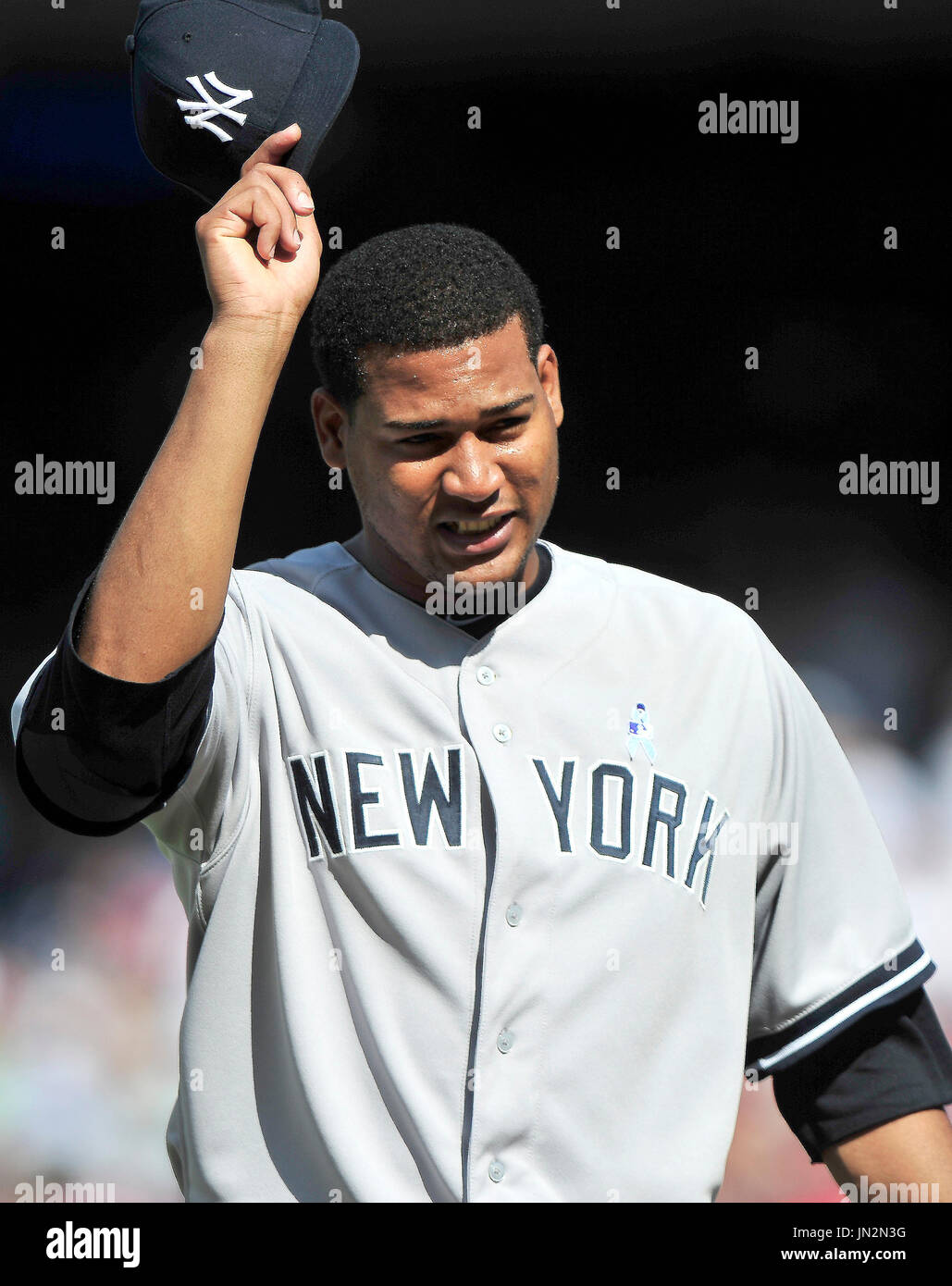 New York Yankees pitcher Ivan Nova tips his hat to the crowd as he