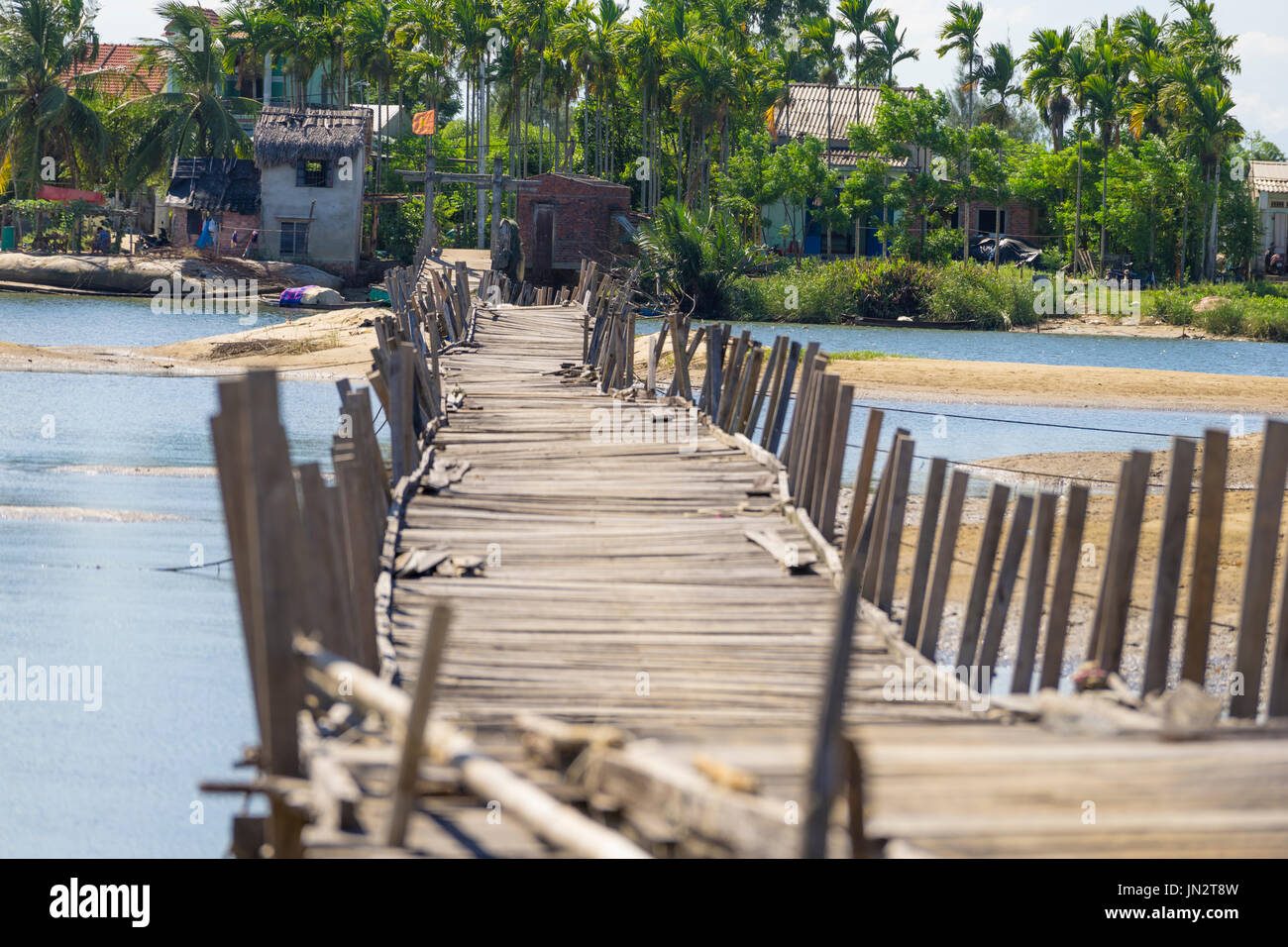 Rickety floating bridge spanning Thu Bon River in rural Vietnam near Hoi An Stock Photo