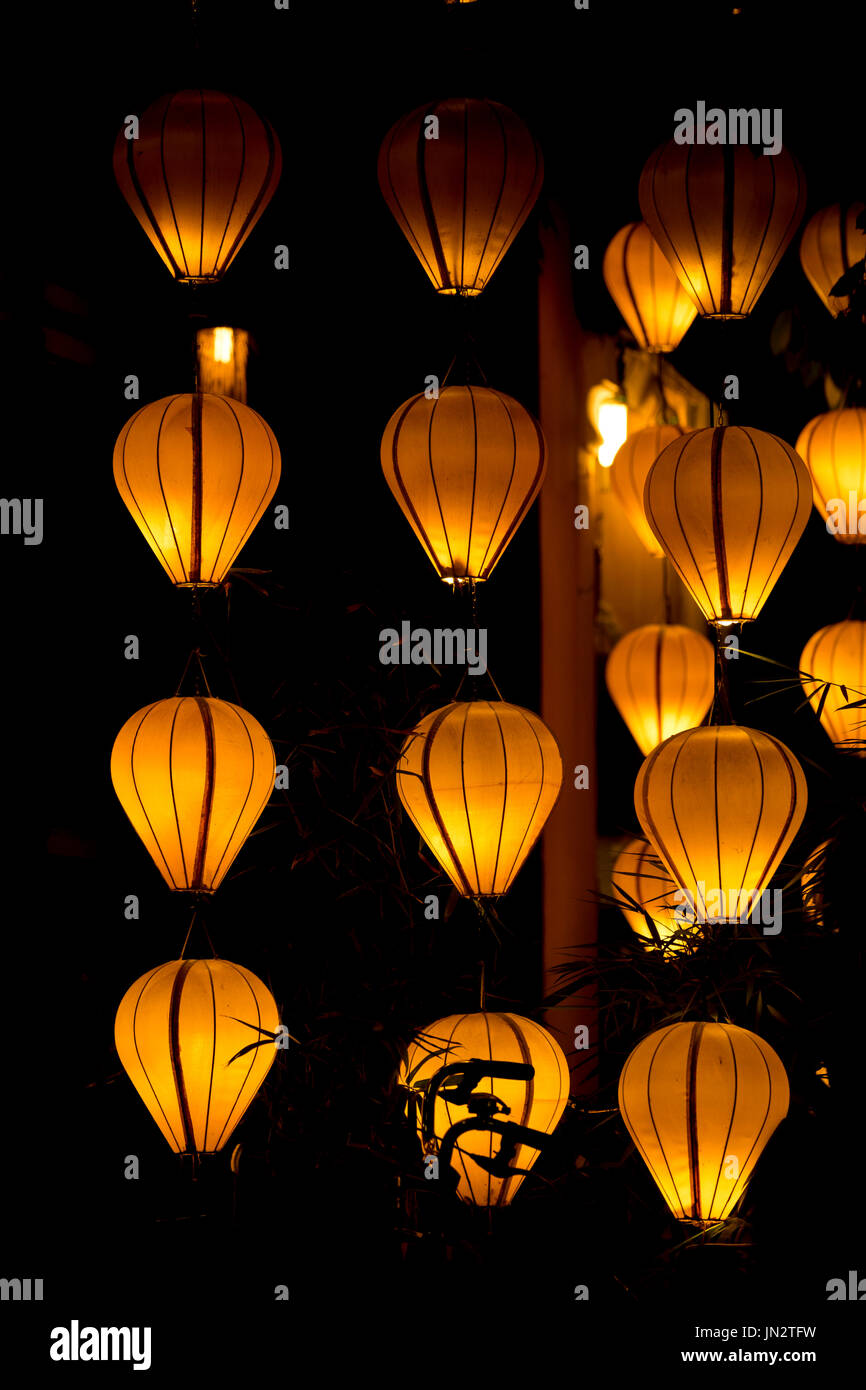 Silk lanterns glowing in the evening in Hoi An, Vietnam, known for its lantern designs Stock Photo