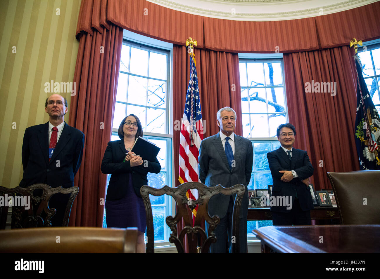 United States Secretary of Defense Chuck Hagel (2R) stands in the Oval Office while U.S. President Barack Obama meets with Sultan Haji Hassanal Bolkiah of Brunei, at the White House on March 12, 2013 in Washington, DC. The two discussed strategic and economic issues in advance of October's East Asia summit and US-ASEAN summit in Brunei. .Credit: Drew Angerer / Pool via CNP Stock Photo