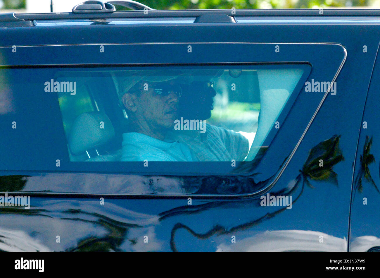 United States President Barack Obama rides in his armored SUV on his ...