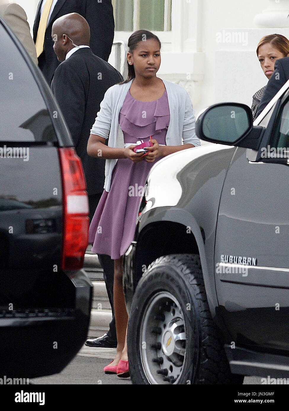 Sasha Obama leaves the North Portico of the White House to attend a
