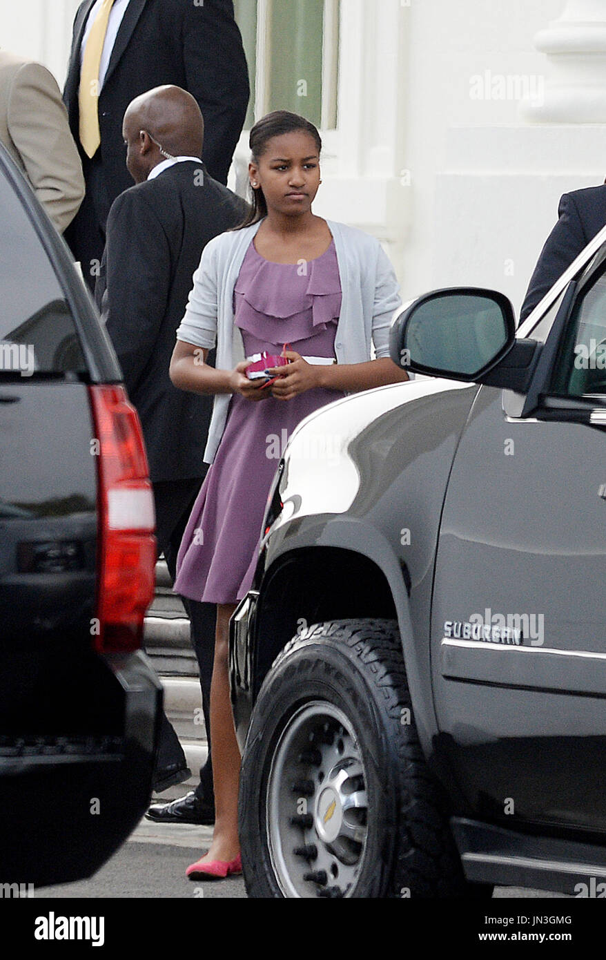 Sasha Obama leaves the North Portico of the White House to attend a