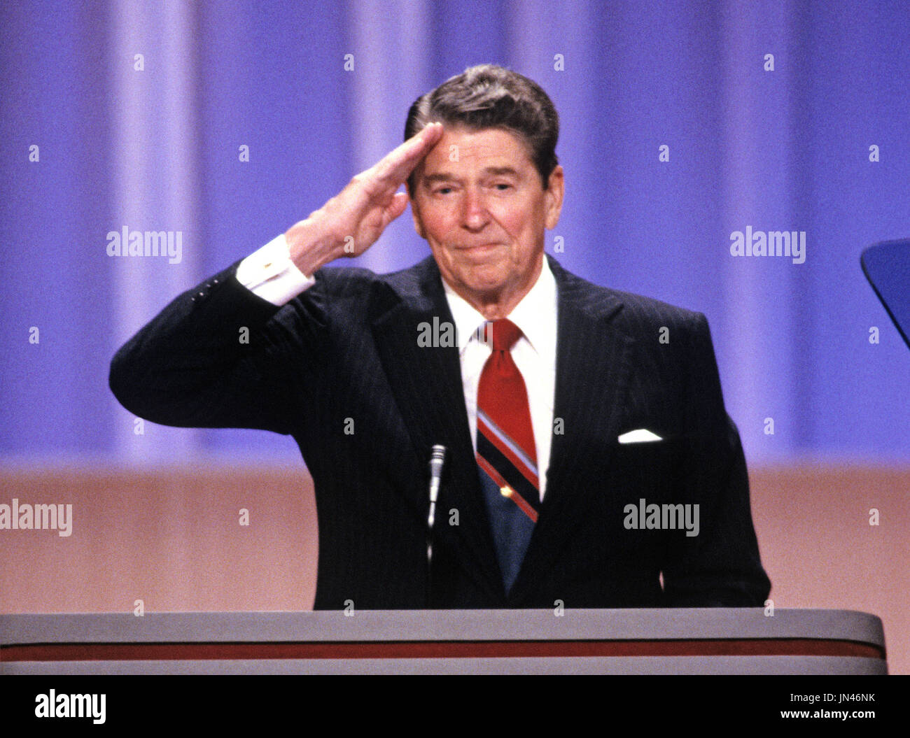 United States President Ronald Reagan offers a military salute to supporters from the podium of the 1988 Republican Convention at the Super Dome in New Orleans, Louisiana on August 15, 1988. Credit: Arnie Sachs / CNP Stock Photo