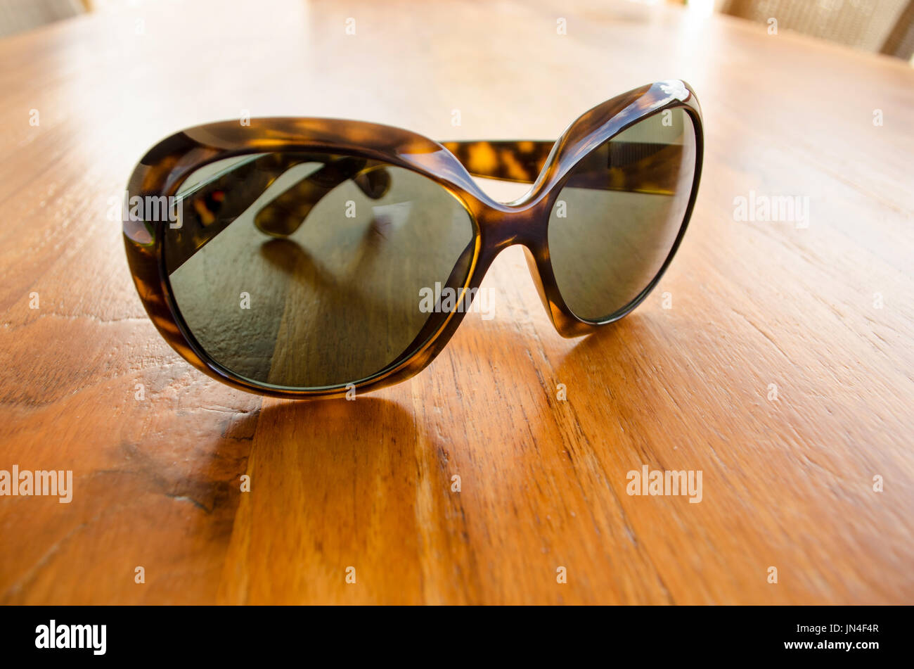 Stylish Sunglasses on Wood Table Stock Photo