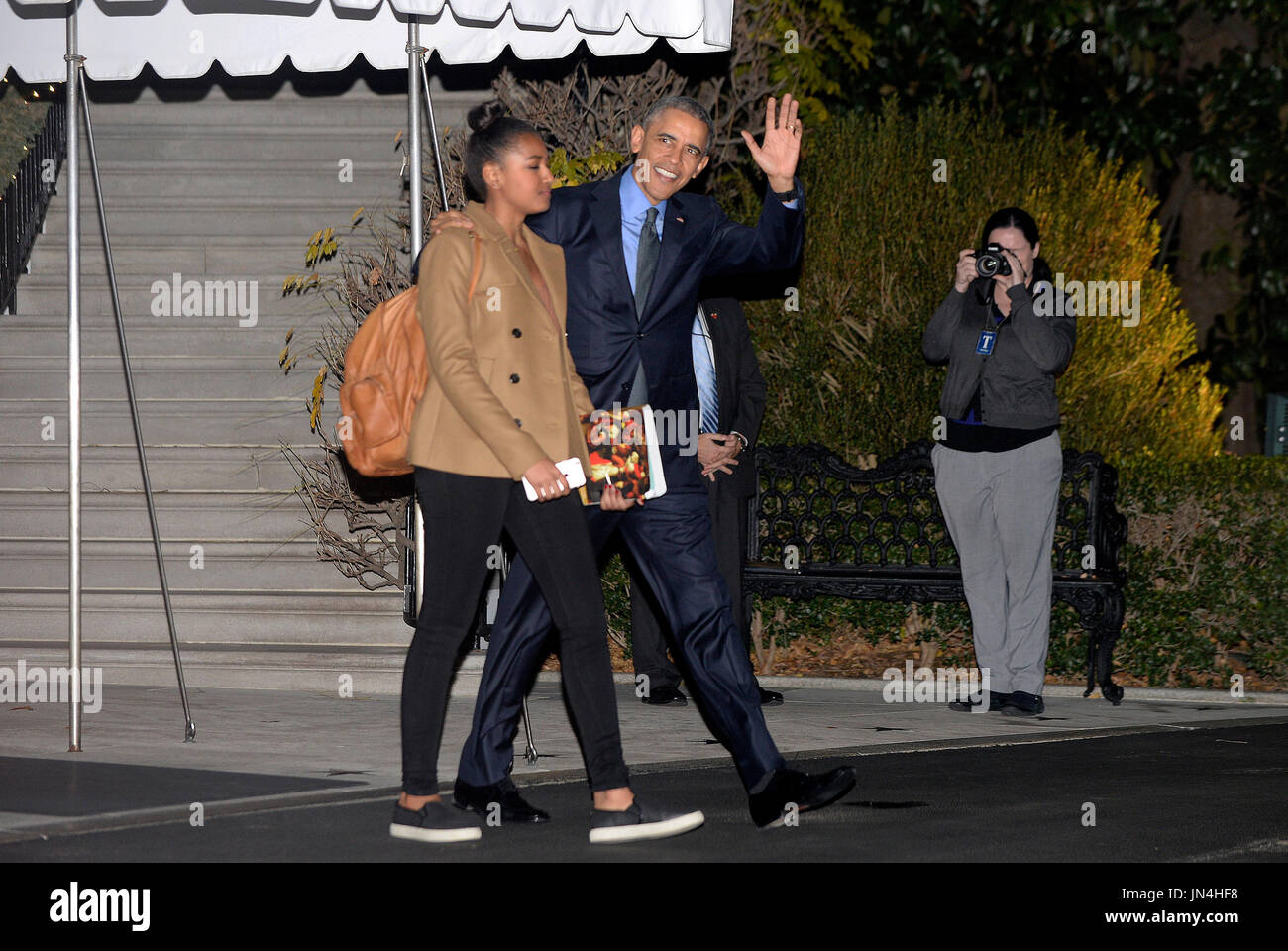 United States President Barack Obama and daughter Sasha depart the