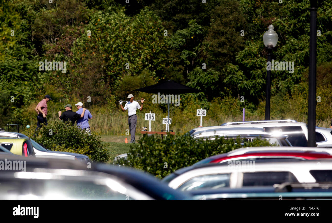 United States President Barack Obama does some stretching exercises ...