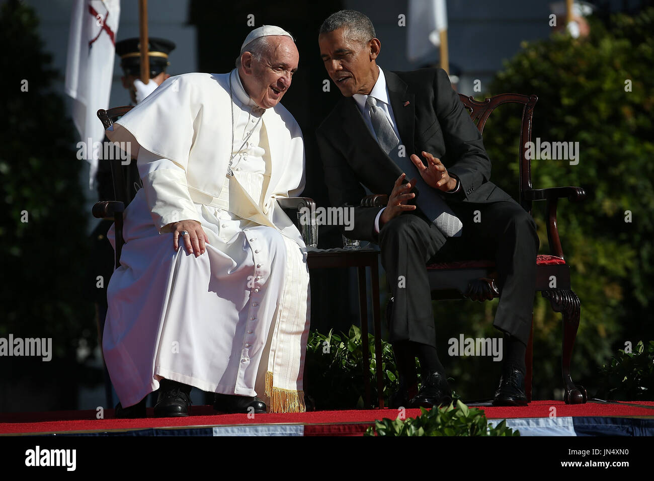 U.S. President Barack Obama (R) confers with Pope Francis (L) during an ...