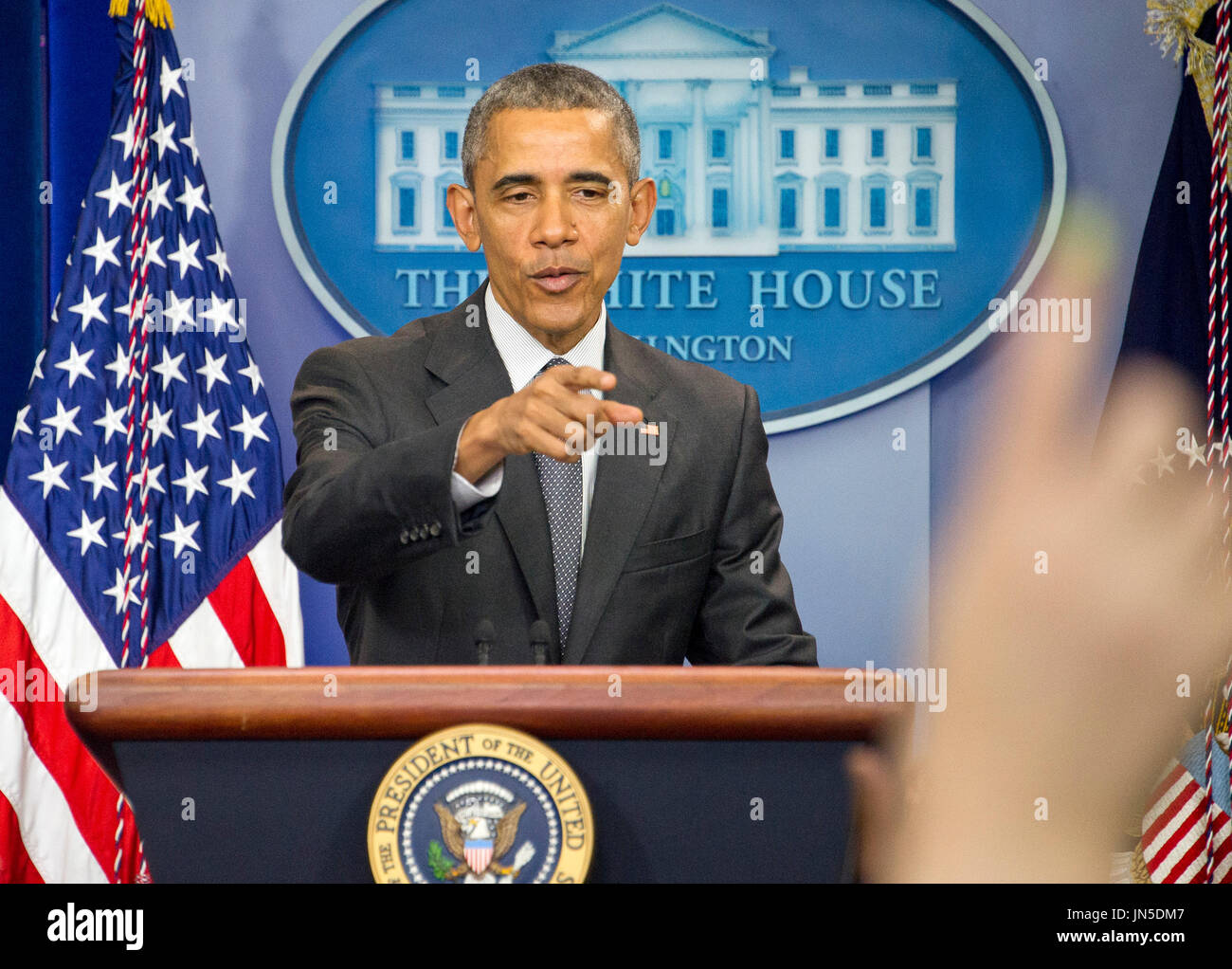 United States President Barack Obama takes a reporter's question after ...