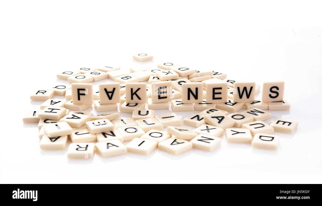 Fake News spelt out on word tiles on a white background. Stock Photo