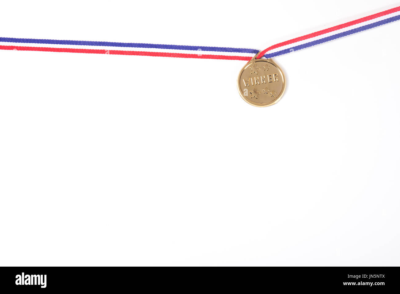Gold medal on a ribbon isolated on white forming a border with copy
