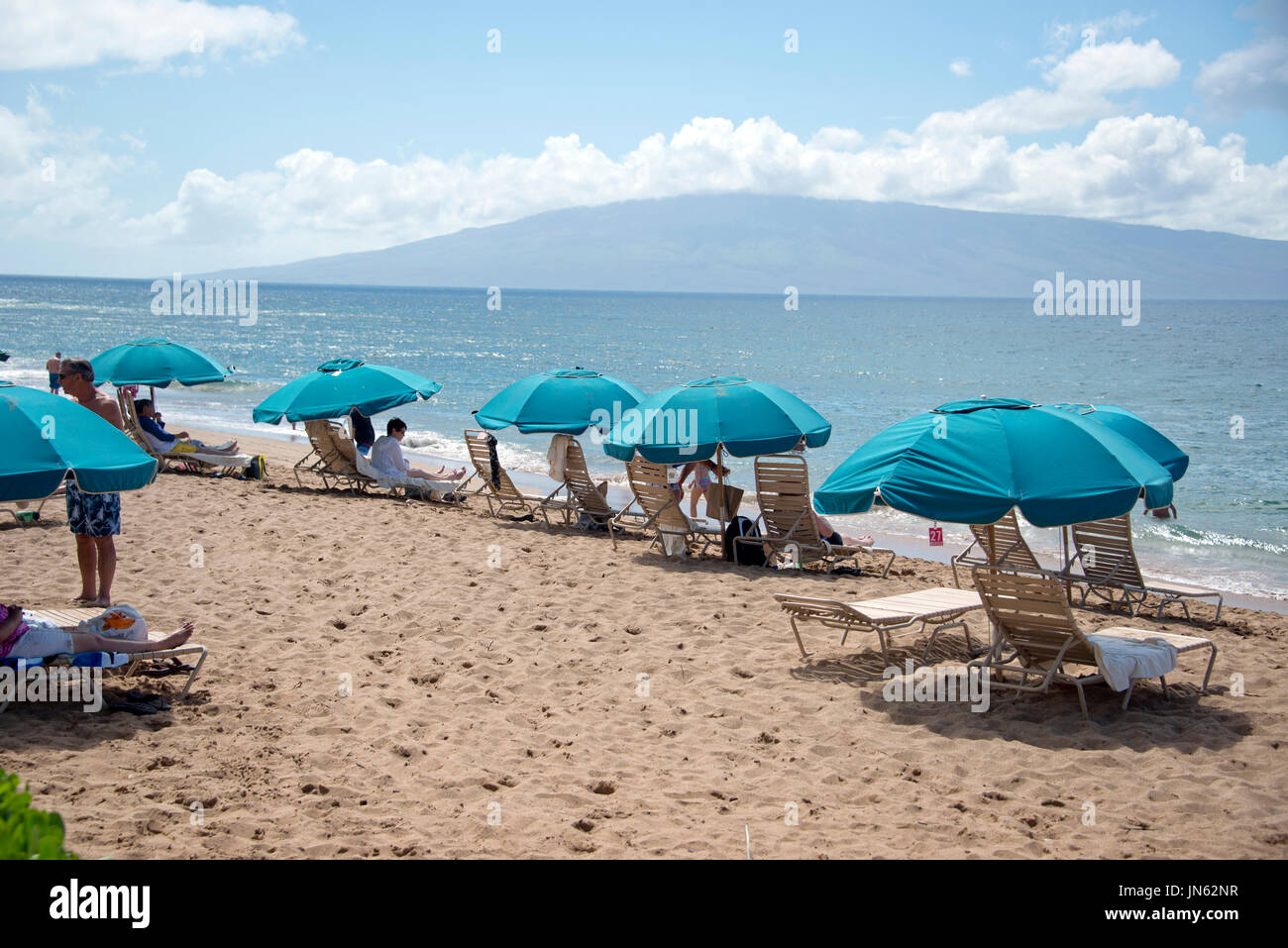 Beach umbrellas along Kaanapali Beach in Lahaina, Maui, Hawaii on