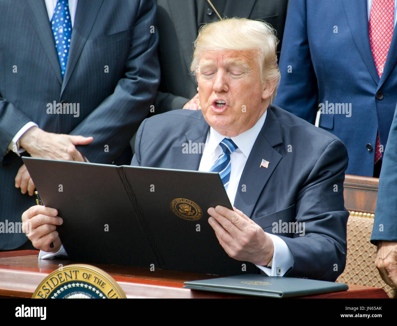 United States President Donald J. Trump signs an Executive Order ...