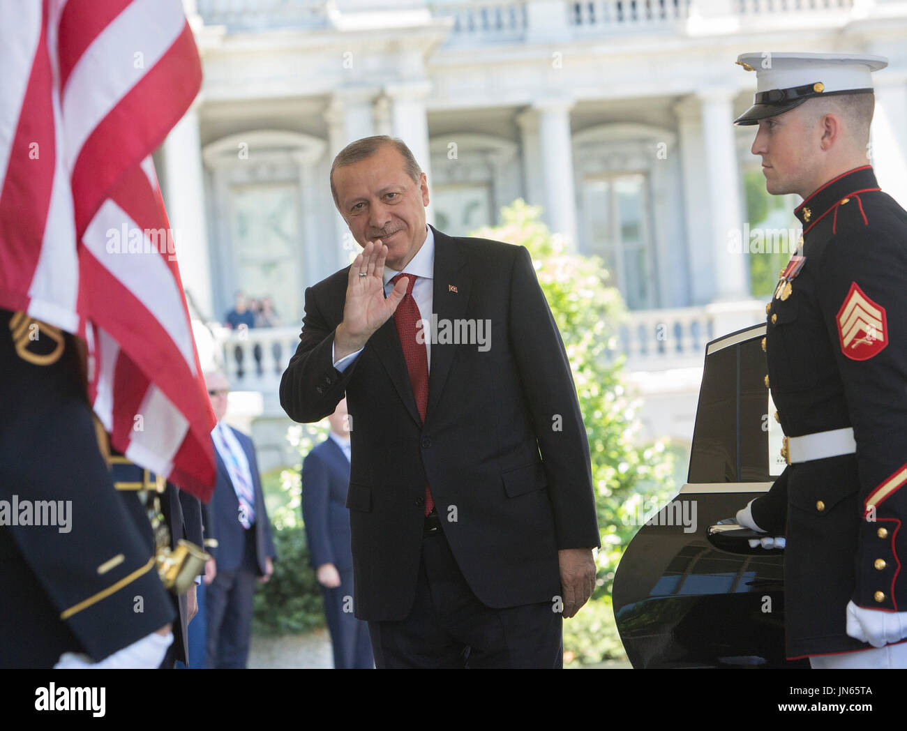 President Recep Tayyip Erdogan of Turkey waves to the press as he is ...